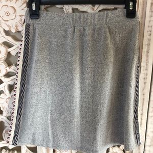 Lined, soft grey skirt with embroidery detail